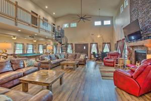 a living room with leather furniture and a fireplace at All-Encompassing Family Retreat Near Lake Texoma! in Kingston