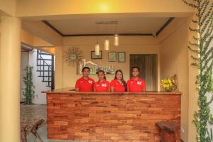 a group of people standing at a bar at Twin House Villa in Coron +41 photos
