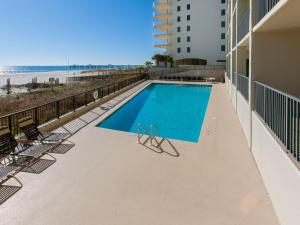 a swimming pool on the balcony of a building at The Palms 313A in Orange Beach