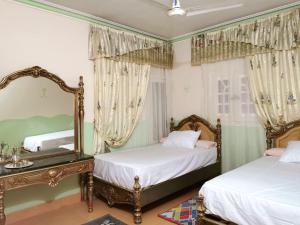 Postel nebo postele na pokoji v ubytování Pyramids House inn