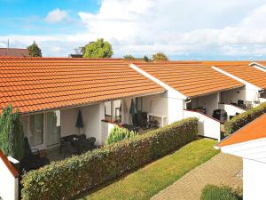 anterior view of a house with an orange roof at 4 person holiday home in r sk bing in Ærøskøbing