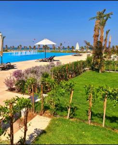 a view of a resort with a swimming pool at Luxurious Sea view 2 BR & private Garden to the pool at Mangroovy in Hurghada