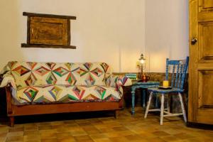 a living room with a couch and a table at Rustic Luxury Retreat Near Historic Zacatlan in Zacatlán