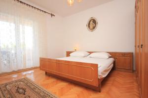 Ένα ή περισσότερα κρεβάτια σε δωμάτιο στο Apartments by the sea Kraj, Pasman - 331