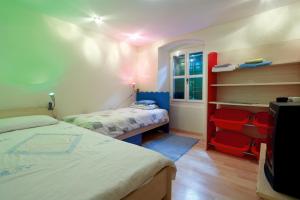 a small bedroom with two beds and a window at Apartments with WiFi Split - 8672 in Split