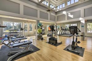 a gym with several treadmills and machines in a room at Coastal Golf Resort Condo Less Than 4 Mi to Beach! in North Myrtle Beach