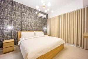 A bed or beds in a room at Hermoso y Seguro apartamento, planta eléctrica full, céntrico