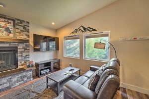 a living room with a couch and a fireplace at Modern Ketchum Condo Walk to Dtwn and Ski Lift in Ketchum