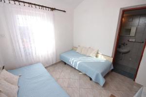 Posteľ alebo postele v izbe v ubytovaní Apartment Stivan 382a