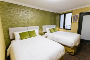 Postel nebo postele na pokoji v ubytování Hotel Richland LES