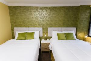 Postel nebo postele na pokoji v ubytování Hotel Richland LES