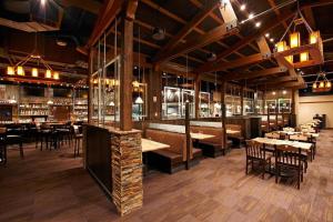 a restaurant with tables and chairs and a bar at Crystal Peak Lodge 1 Bedroom Ski In, Ski Out Slopeside Condo At The Base Of Peak 7 in Breckenridge