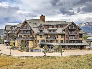 a large apartment building with a large at Crystal Peak Lodge 1 Bedroom Ski In, Ski Out Slopeside Condo At The Base Of Peak 7 in Breckenridge