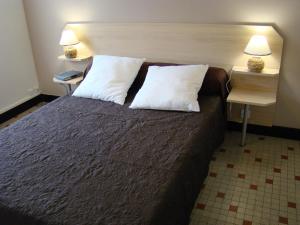 Les Gîtes Malidri客房内的一张或多张床位