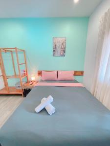 Postel nebo postele na pokoji v ubytování LANGCHIA HOME