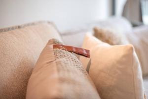 a close up of a couch with ainylinylinylinylinylinylinylinyl at Modern flat with KING SIZE bed and HIGH SPEED Wifi in Dubai