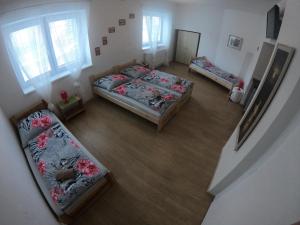 an overhead view of a bedroom with three beds at Rodinný Penzion Kyjov in Kyjov