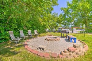 a fire pit with chairs and a grill in a yard at Spacious Springfield Apt Less Than 4 Mi to Downtown! in Springfield