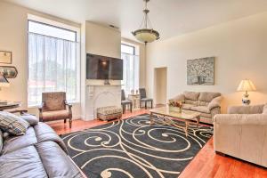 a living room with a couch and a table at Spacious Springfield Apt Less Than 4 Mi to Downtown! in Springfield