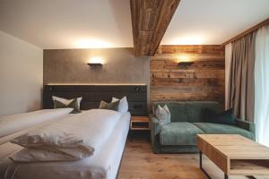 Postel nebo postele na pokoji v ubytování Hotel Stubai