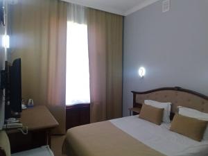Postel nebo postele na pokoji v ubytování Shindan Hotel Astara