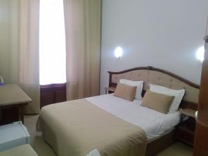 Postel nebo postele na pokoji v ubytování Shindan Hotel Astara
