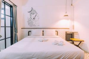 Postel nebo postele na pokoji v ubytování V1 Room Hotel