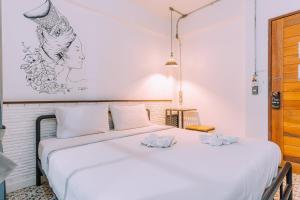 Postel nebo postele na pokoji v ubytování V1 Room Hotel