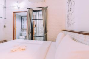 Postel nebo postele na pokoji v ubytování V1 Room Hotel