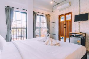 Postel nebo postele na pokoji v ubytování V1 Room Hotel