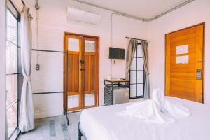 Postel nebo postele na pokoji v ubytování V1 Room Hotel