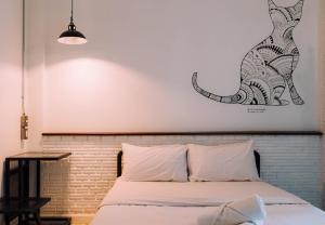 Postel nebo postele na pokoji v ubytování V1 Room Hotel