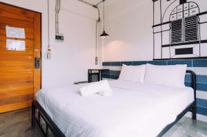 Postel nebo postele na pokoji v ubytování V1 Room Hotel