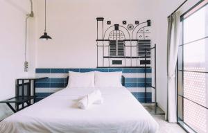Postel nebo postele na pokoji v ubytování V1 Room Hotel