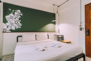 Postel nebo postele na pokoji v ubytování V1 Room Hotel