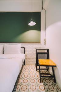 Postel nebo postele na pokoji v ubytování V1 Room Hotel
