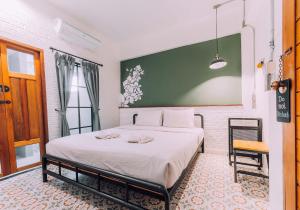 Postel nebo postele na pokoji v ubytování V1 Room Hotel