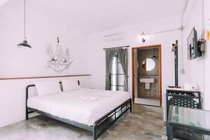Postel nebo postele na pokoji v ubytování V1 Room Hotel
