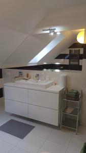 a white bathroom with a sink and a ceiling at Komfortowe Noclegi in Szałsza +30 photos