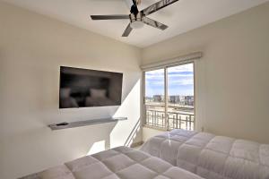 a bedroom with a bed and a large window at Luxe Cabo Casa w/ Own Rooftop Patio + Pool Access! in Cabo San Lucas