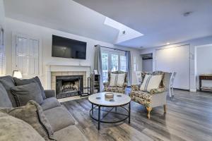 a living room with a couch and a fireplace at Norwich The Villas Near Mohegan Sun Casino in Norwich