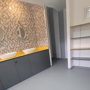 a bathroom with two sinks and a mirror at ALBERGUE de Caldas de Reis URRACA in Caldas de Reis +49 photos