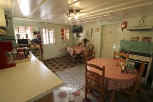 a kitchen with a table and chairs in a room at Chalet la Griotte in Villars-sur-Ollon