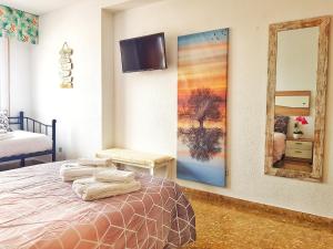 Rúm í herbergi á Panorama Córdoba Center, baño privado externo a la habitación