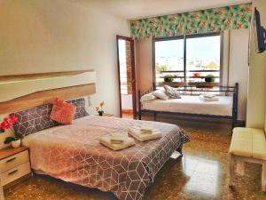 Rúm í herbergi á Panorama Córdoba Center, baño privado externo a la habitación