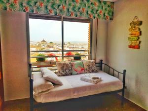Rúm í herbergi á Panorama Córdoba Center, baño privado externo a la habitación
