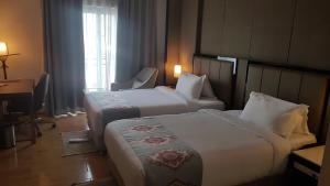 Postel nebo postele na pokoji v ubytování Check Inn Hotel Addis Ababa