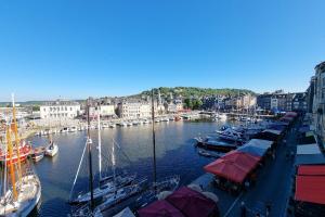 a group of boats docked in a harbor at Chambres Houdaille in Honfleur