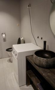 a bathroom with a sink and a toilet at Koselig og sentral hytte midt i Hemsedal in Kyrkjebøen
