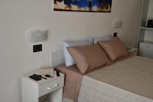 Postel nebo postele na pokoji v ubytování La casa del tempo - Urban resort